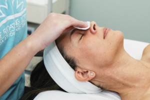 Photo of a woman's restful face during a facial treatment.